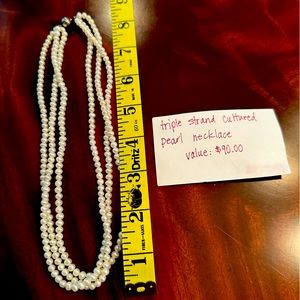 Custom made triple strand cultured pearl necklace.